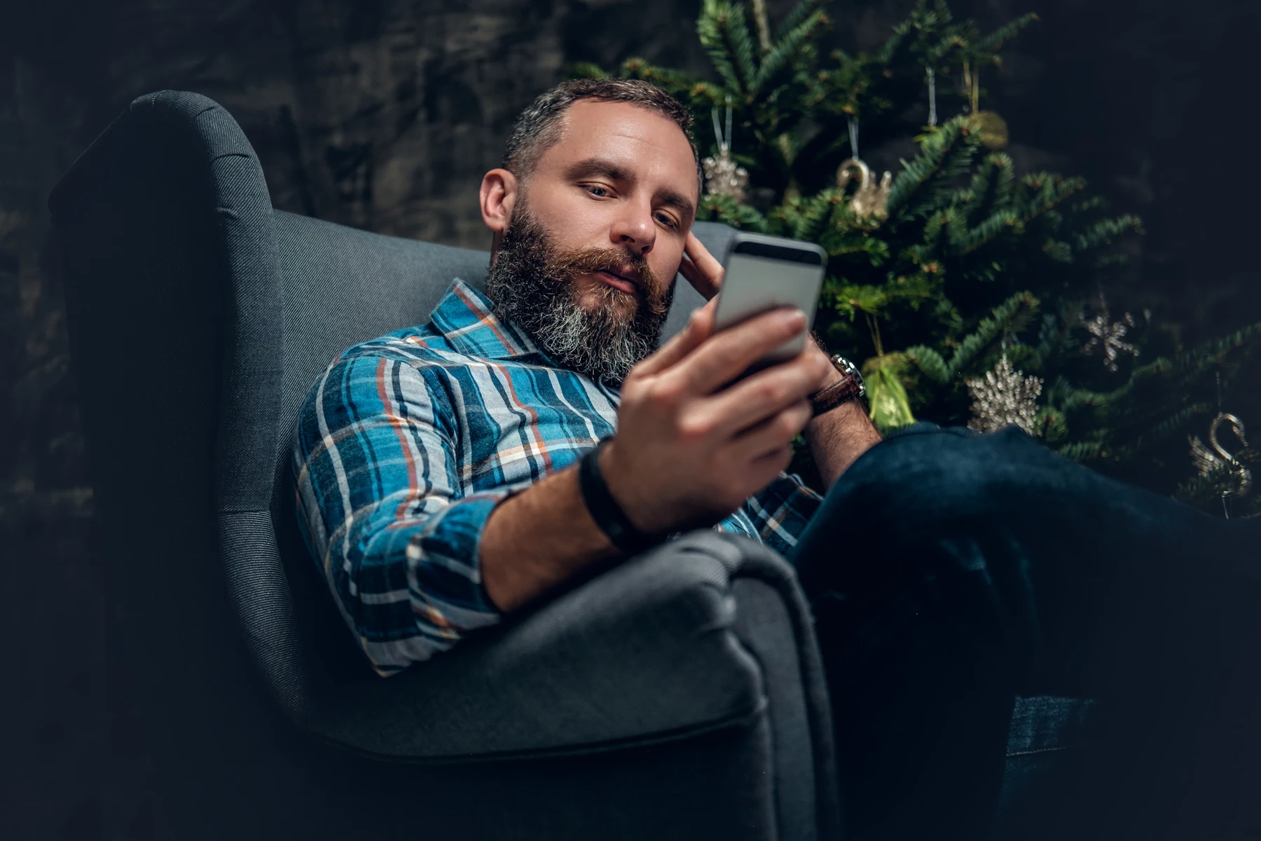 A man using his phone at home